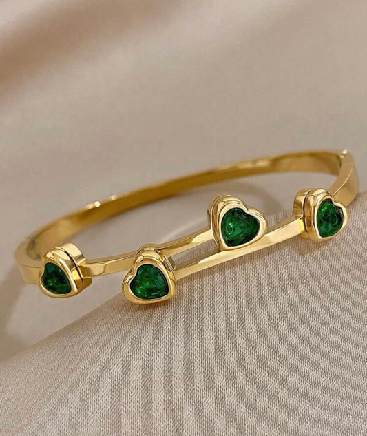 Green cubic zirconia heart bracelet.