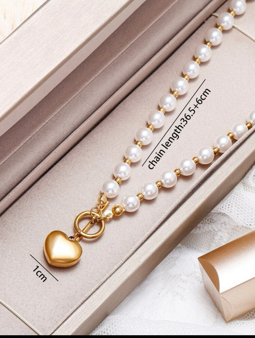 18k gold plated pearl heart charm necklace.