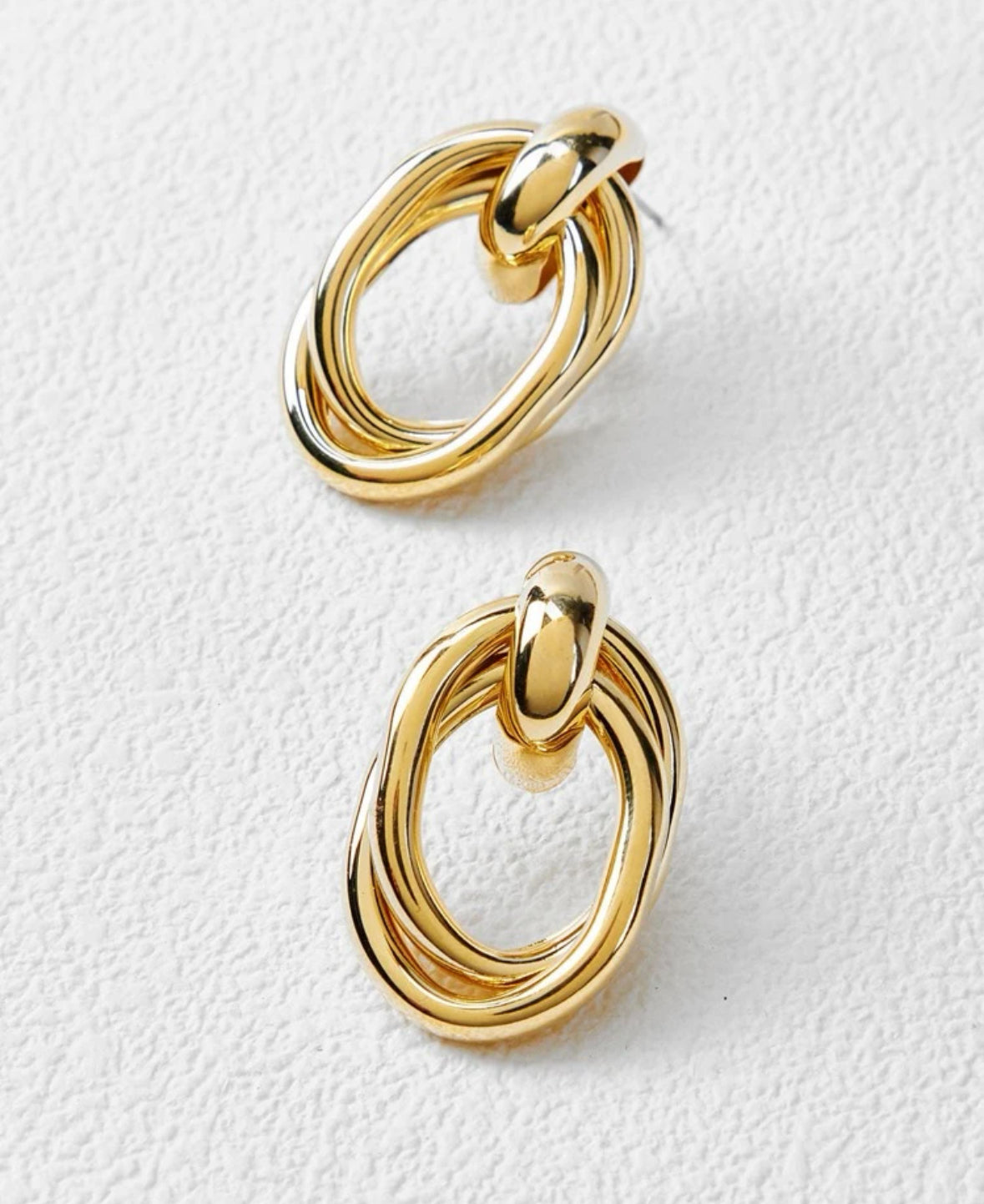 angled pair of 14k gold pated earring